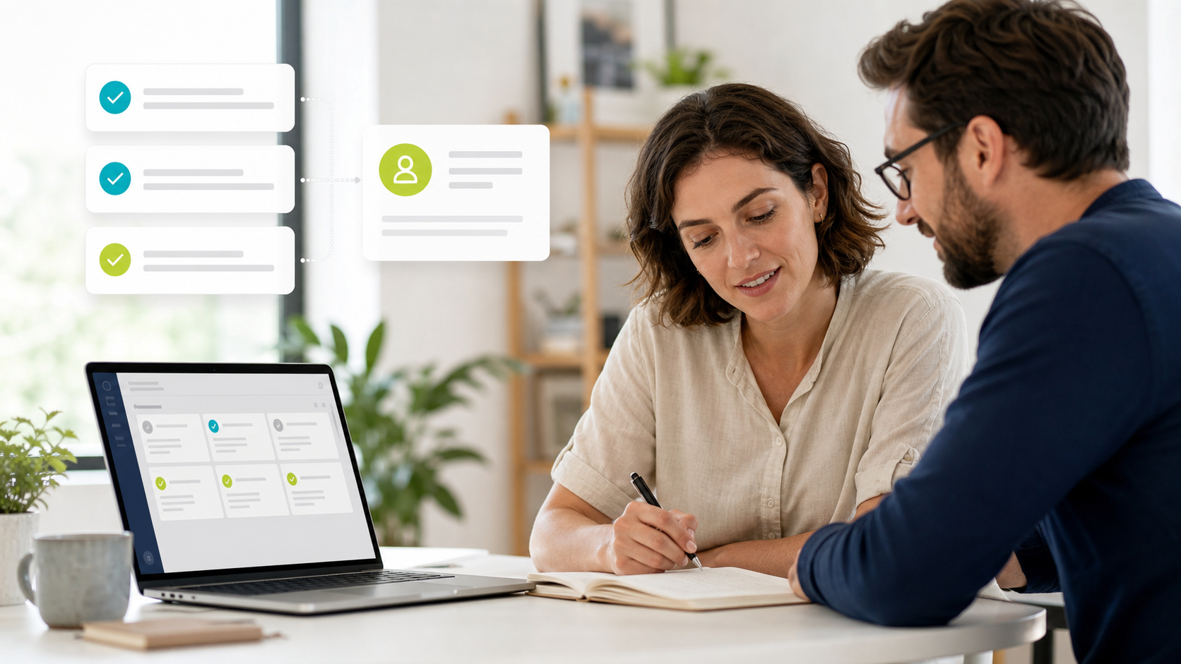 Two colleagues discussing customer work beside a laptop with organised workflow cards and completed task icons